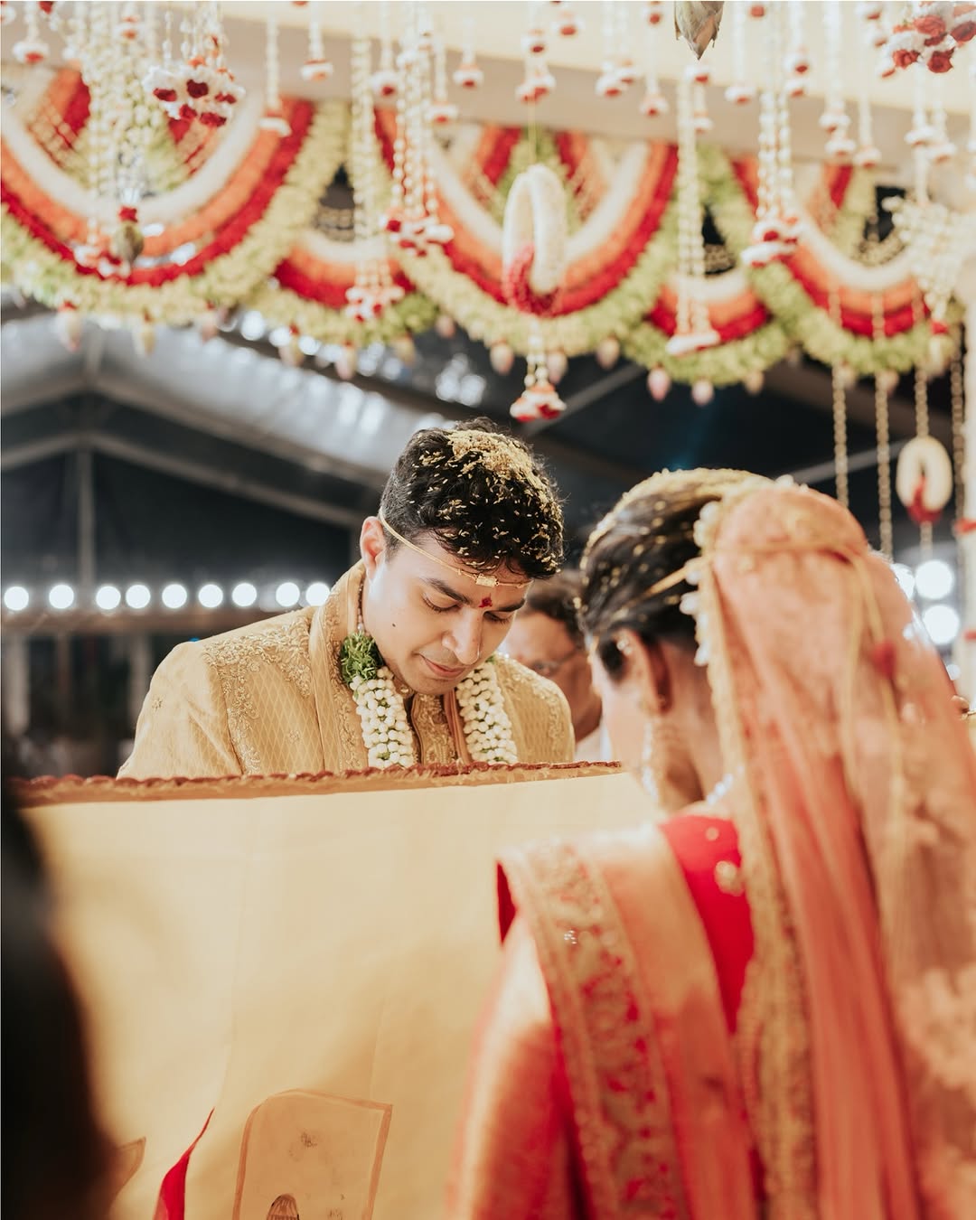 Couple exchanging wedding vows at a mountain venue in India